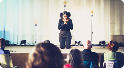 Presenter speaking to an audience in a classroom