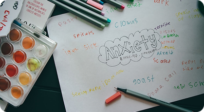 Psychology notes with colored pencils and learning materials